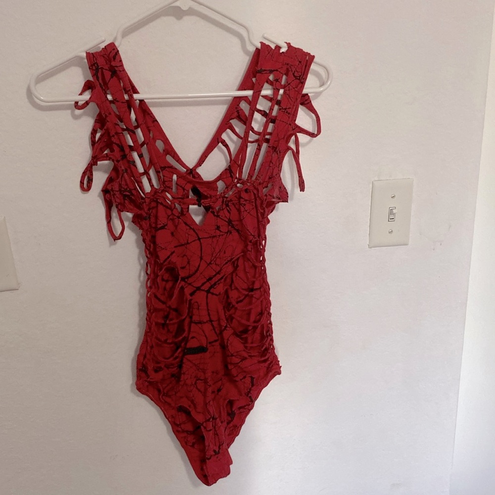 Twisted movement leotard with cut outs and paint splatter perfect for dancing